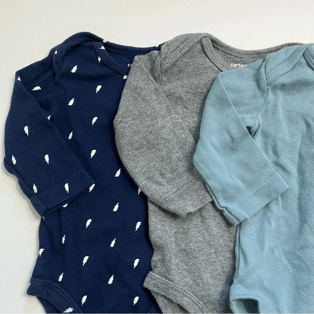 Carters • 4 Pack Baby Onesies Size 3 Months